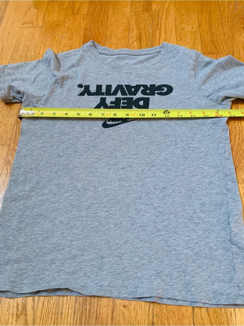 2 Nike Boys L Shirts : Defy Gravity' Nike tee and a green Milltown United jersey